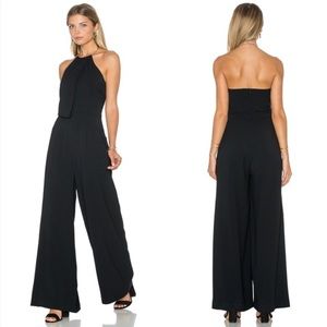 Black jumpsuit with gold necklace clasp
